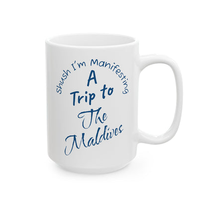 A Trip To The Maldives Ceramic Mug — 'Shush I'm Manifesting' In Blue On White Coffee Cup (11oz & 15oz)