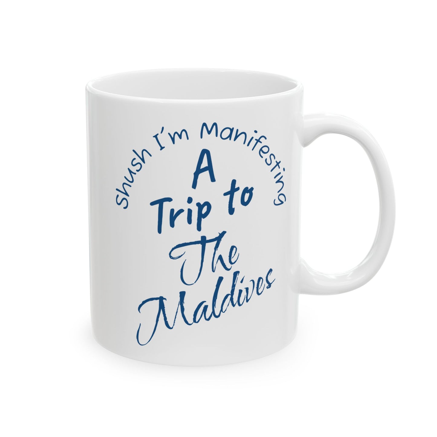 A Trip To The Maldives Ceramic Mug — 'Shush I'm Manifesting' In Blue On White Coffee Cup (11oz & 15oz)