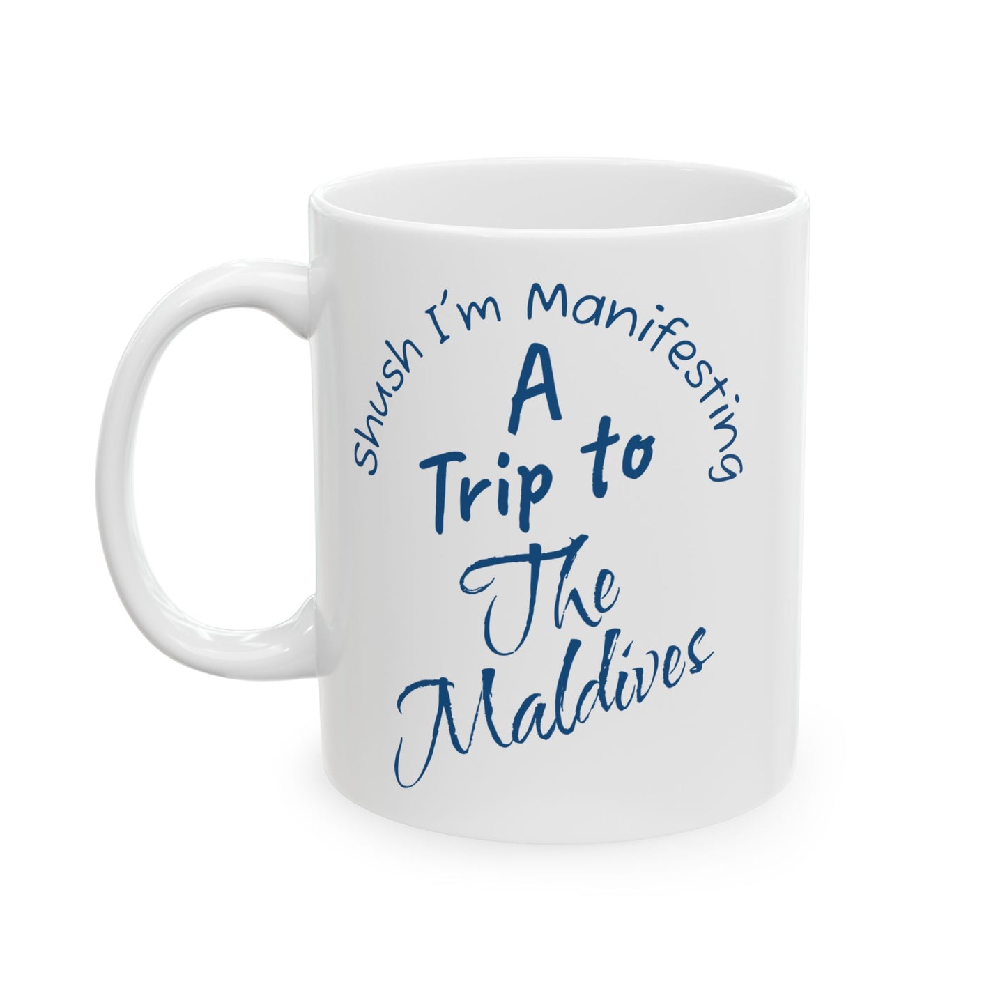 A Trip To The Maldives Ceramic Mug — 'Shush I'm Manifesting' In Blue On White Coffee Cup (11oz & 15oz)